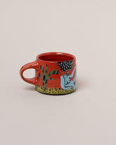 Maggie Boyd Blue Lady Lounges Mug on light color background.