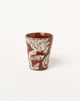 Maggie Boyd Two Chocolate & White Flower Tumbler on light color background.