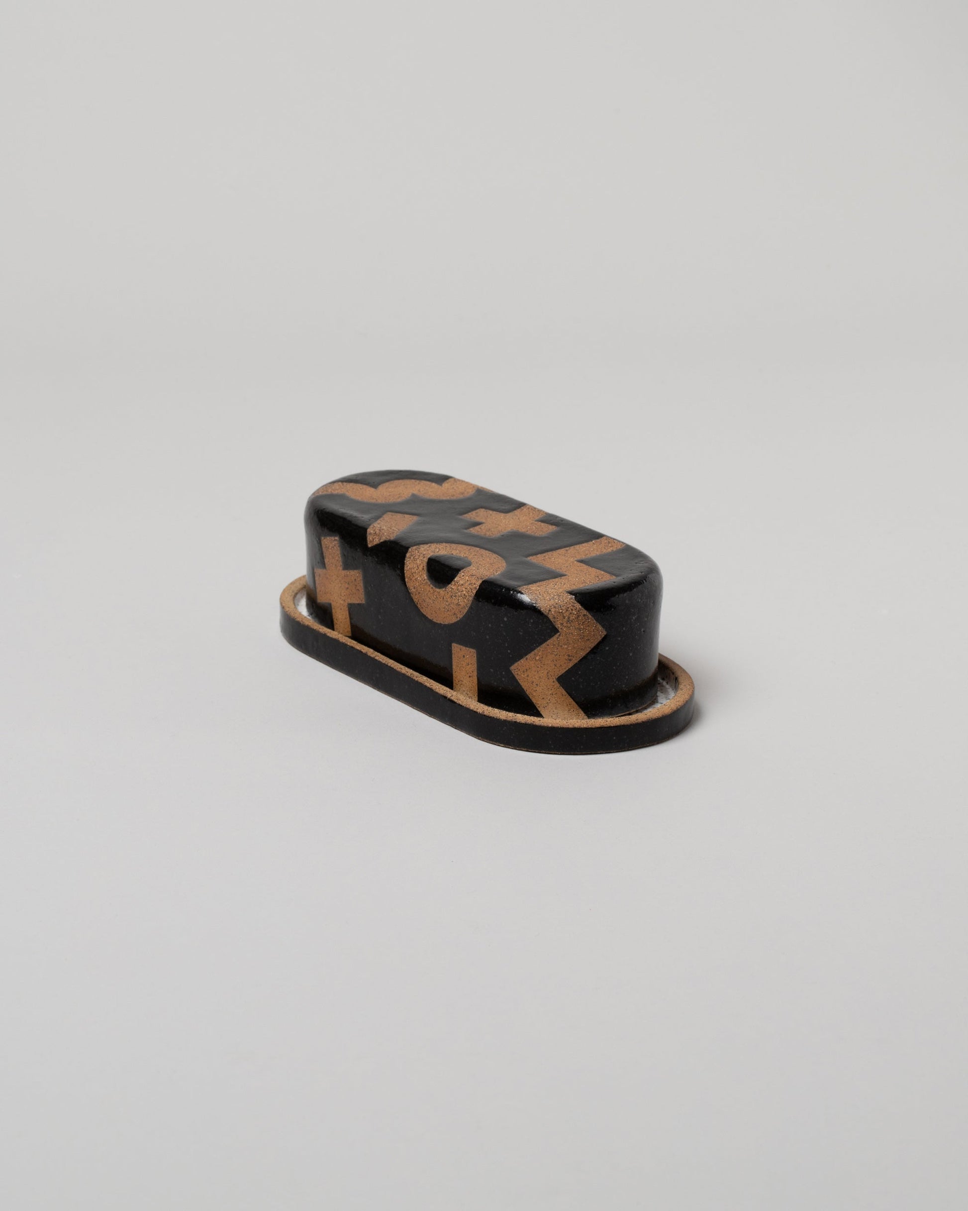 Recreation Center Tan Positive Shapes Butter Dish on light color background.