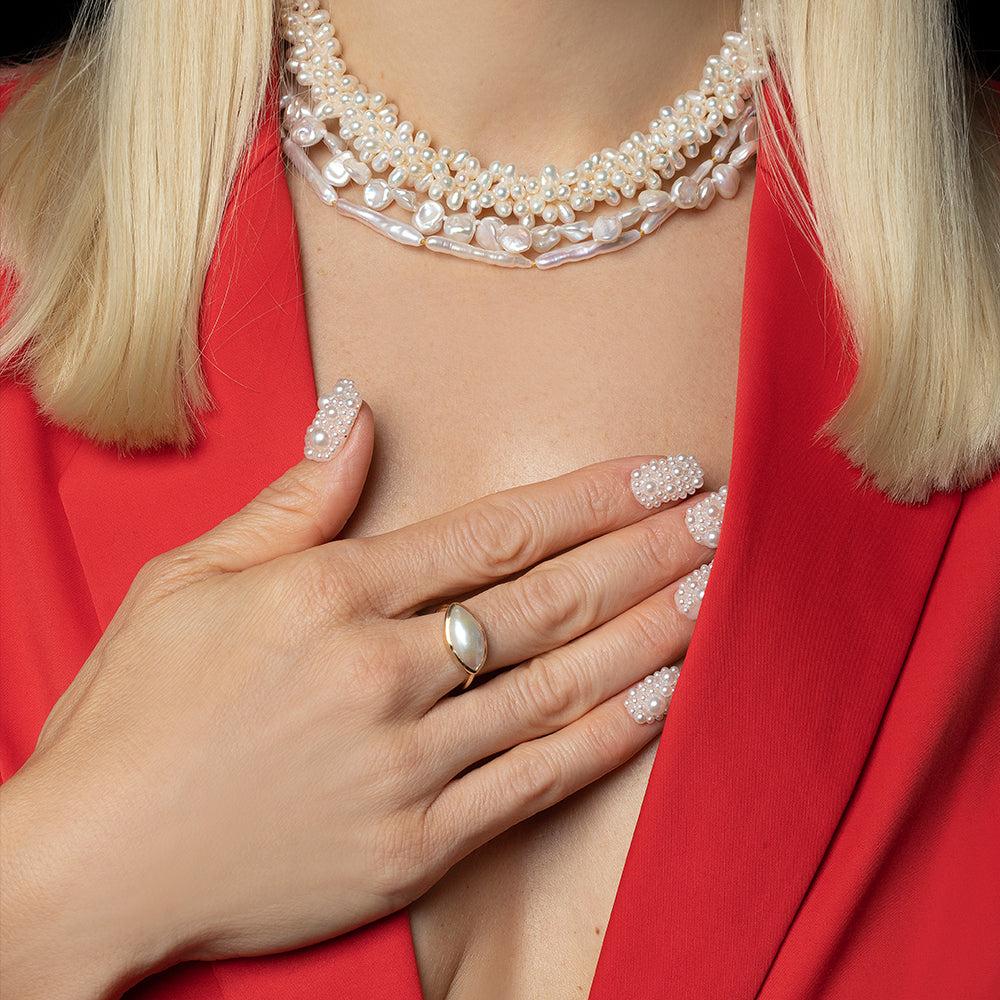 product_details::18k Gold Jacana Pearl Ring on light color background.
