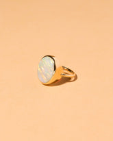 View from the side of the Australian Opal Ring on light color background.