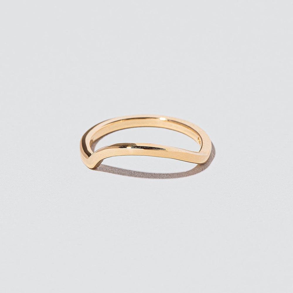 product_details::Gold Solid Square Wire Left Slump Band on light color background.