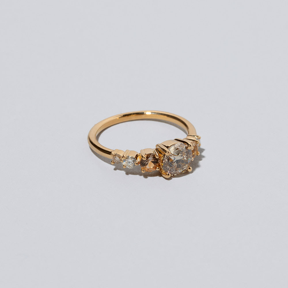 product_details::Closeup details of the Champagne Diamond Capella Ring on light color background.