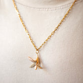 product_details::2.2mm Beveled Oval Chain Necklace and Banana Peel Charm on model.