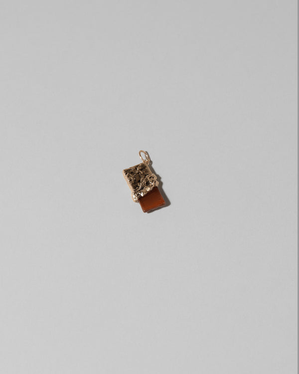 Closeup details of the Chocolate Bar Charm on light color background.