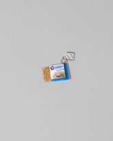 Instant Ramen Charm on light color background.
