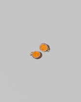 Passion Fruit Charms on light color background.