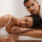 product_details::Styled image of models wearing jewelry from the Cut-Outs Collection, including the Orange Sapphire Venus Ring.