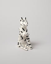 View from the side of the Eleonor Boström Black Key Cat on light color background.