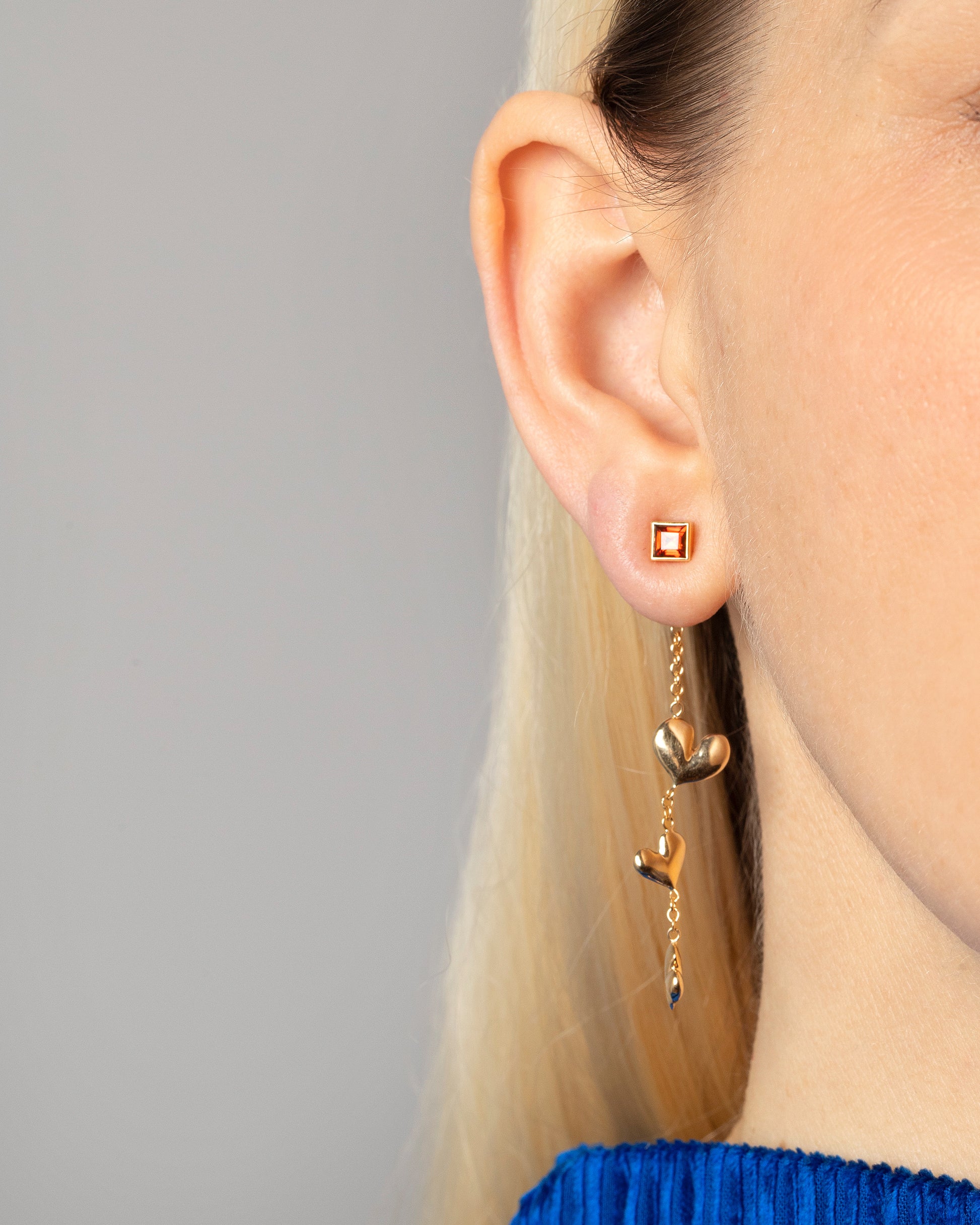 Gold Thousand & One Night Heart Earring Jackets and Orange Sapphire Square Frame Studs on model.
