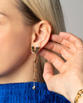 Gold Thousand & One Night Heart Shoulder Duster Earrings on model.