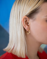 Gold Wild Poppies Hoop Earrings on model.