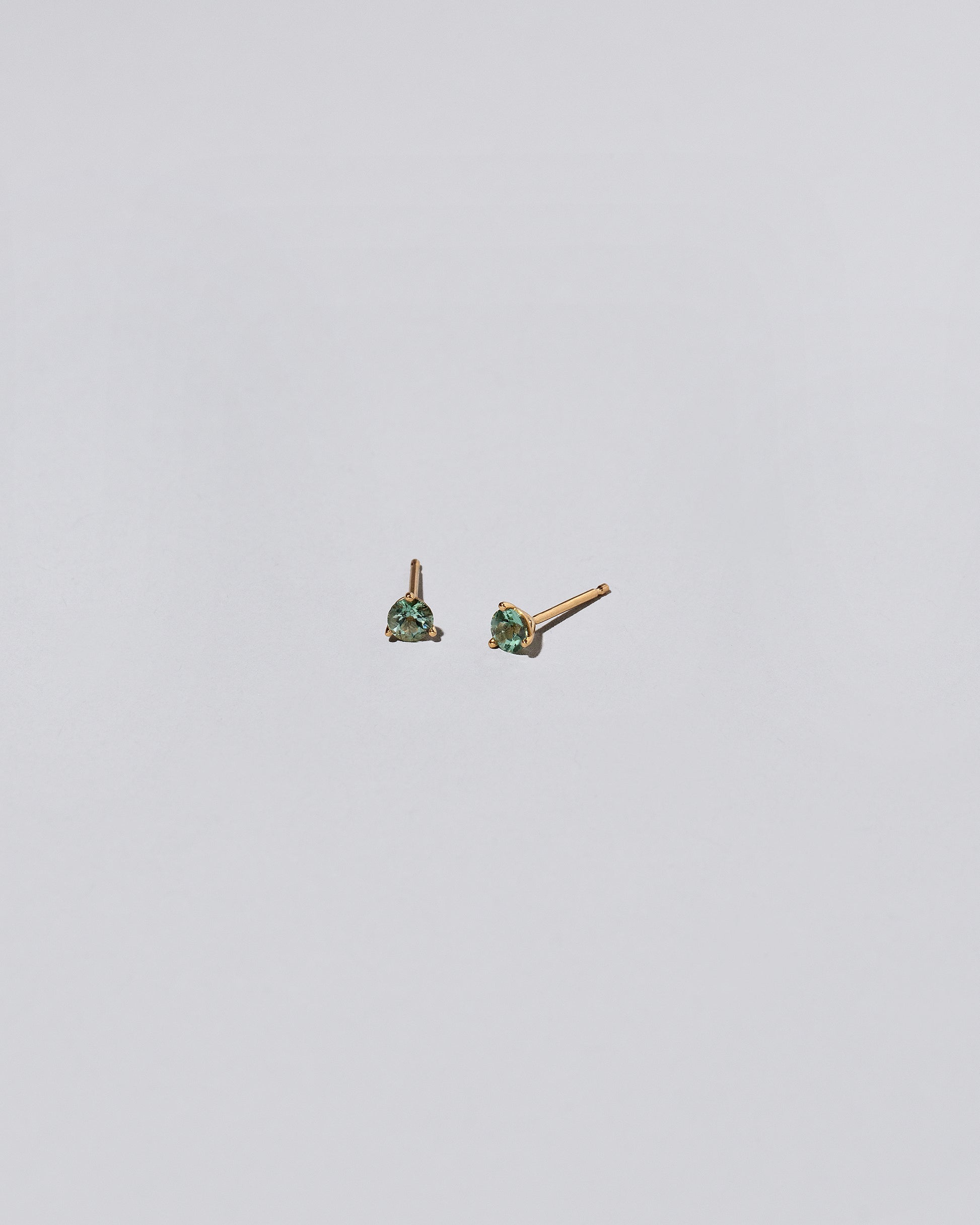 Tourmaline Stud Earrings on light color background.