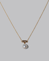 Closeup details of the Poseidon Necklace on light color background.