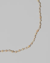Closeup details of the Ula Pearl Necklace 004 on light color background.