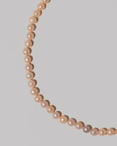 Closeup details of the Faceted Sugar Pearl Necklace on light color background.