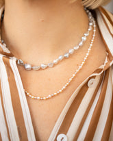 product_details::Ula Pearl Necklace 007 and Ula Pearl Necklace 001 on model.