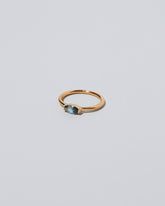 View from the side of the Blue Devant Ring on light color background.