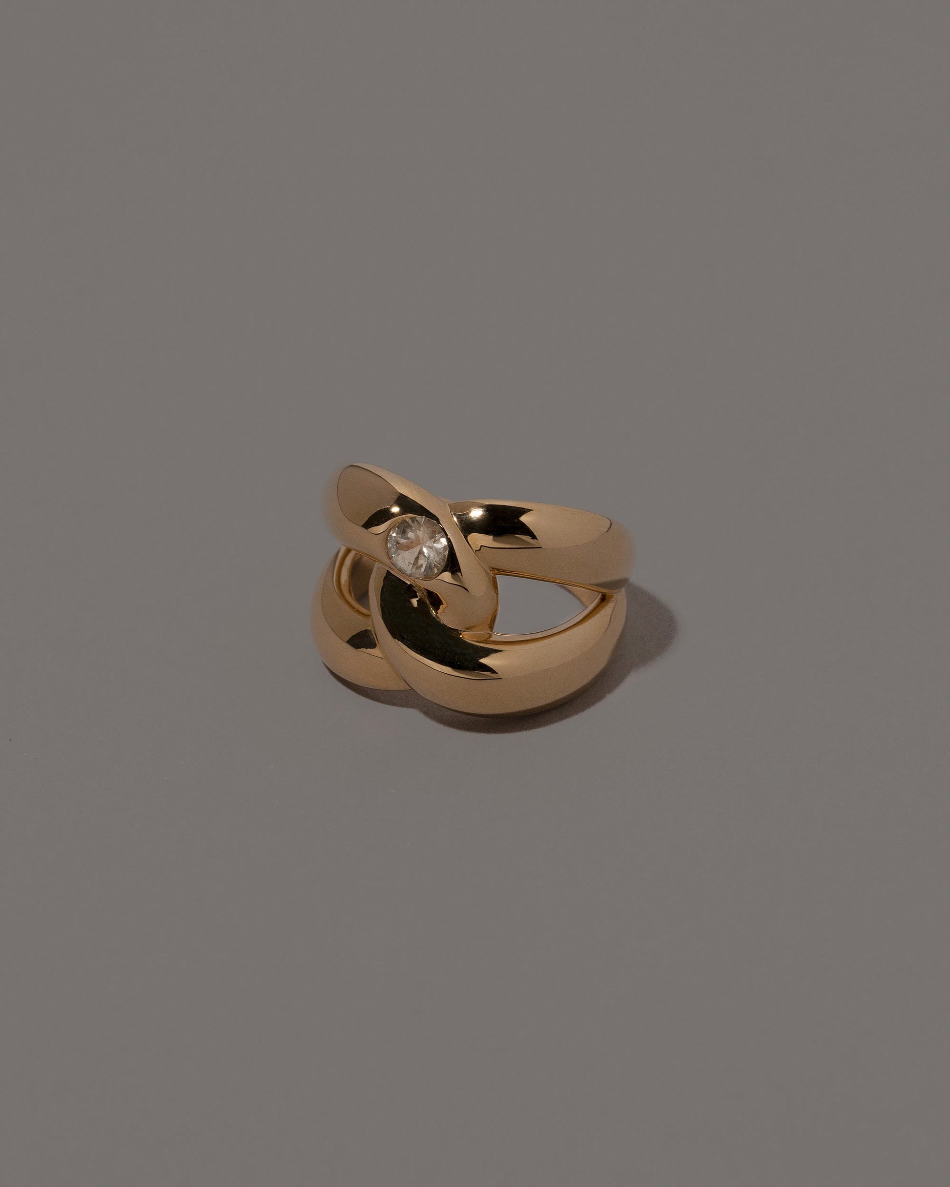 View from the side of the One Ring on grey color background.