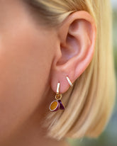 Passion Fruit Charms paired with Gold Poppy Flower Bud Hoop Earrings and styled with Huggie Gold Diamond Snack Hoop Earrings on model.