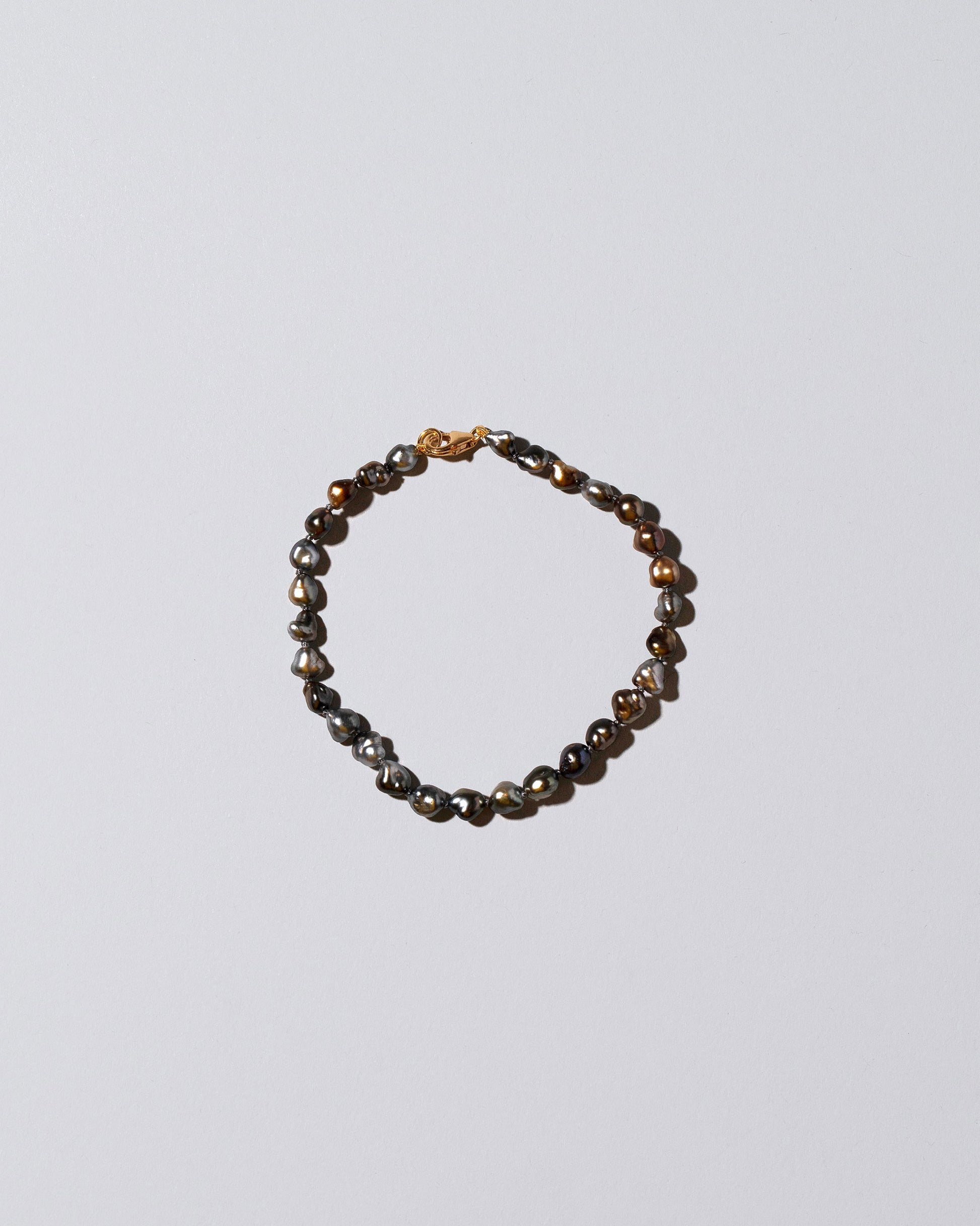 Tahitian Pearl Bracelet on light color background.