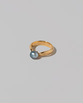 View from the side of the Scylla Ring on light color background.