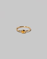 Citrine Birthstone Level Ring on light color background.