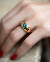 Teal Sapphire Jupiter Ring on model.