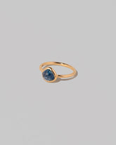 View from the side of the Gusher Blue Sapphire Ring 005 on light color background.