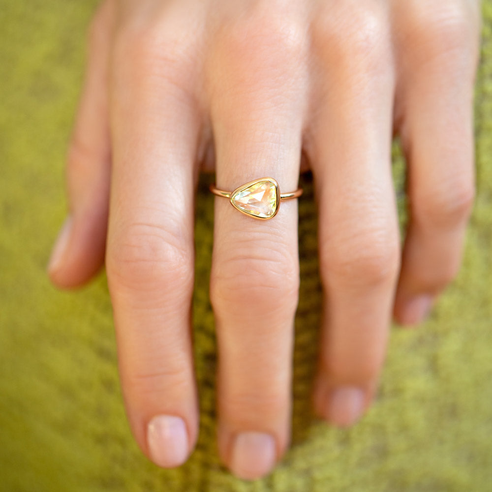 product_details::Gusher Chartreuse Sapphire Ring 003 on model.