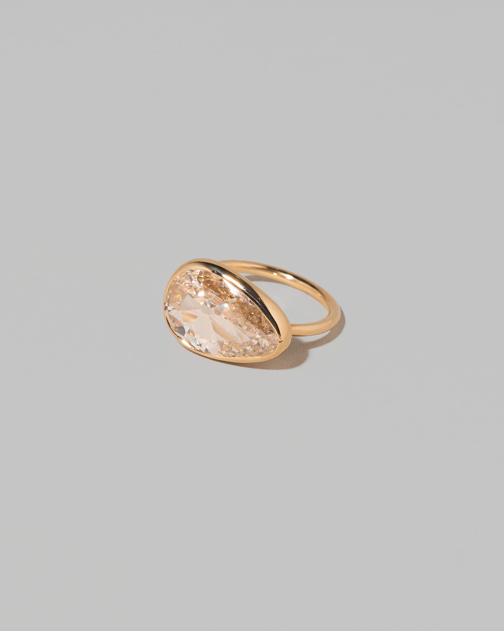 View from the side of the Gusher Diamond Ring 009 on light color background.