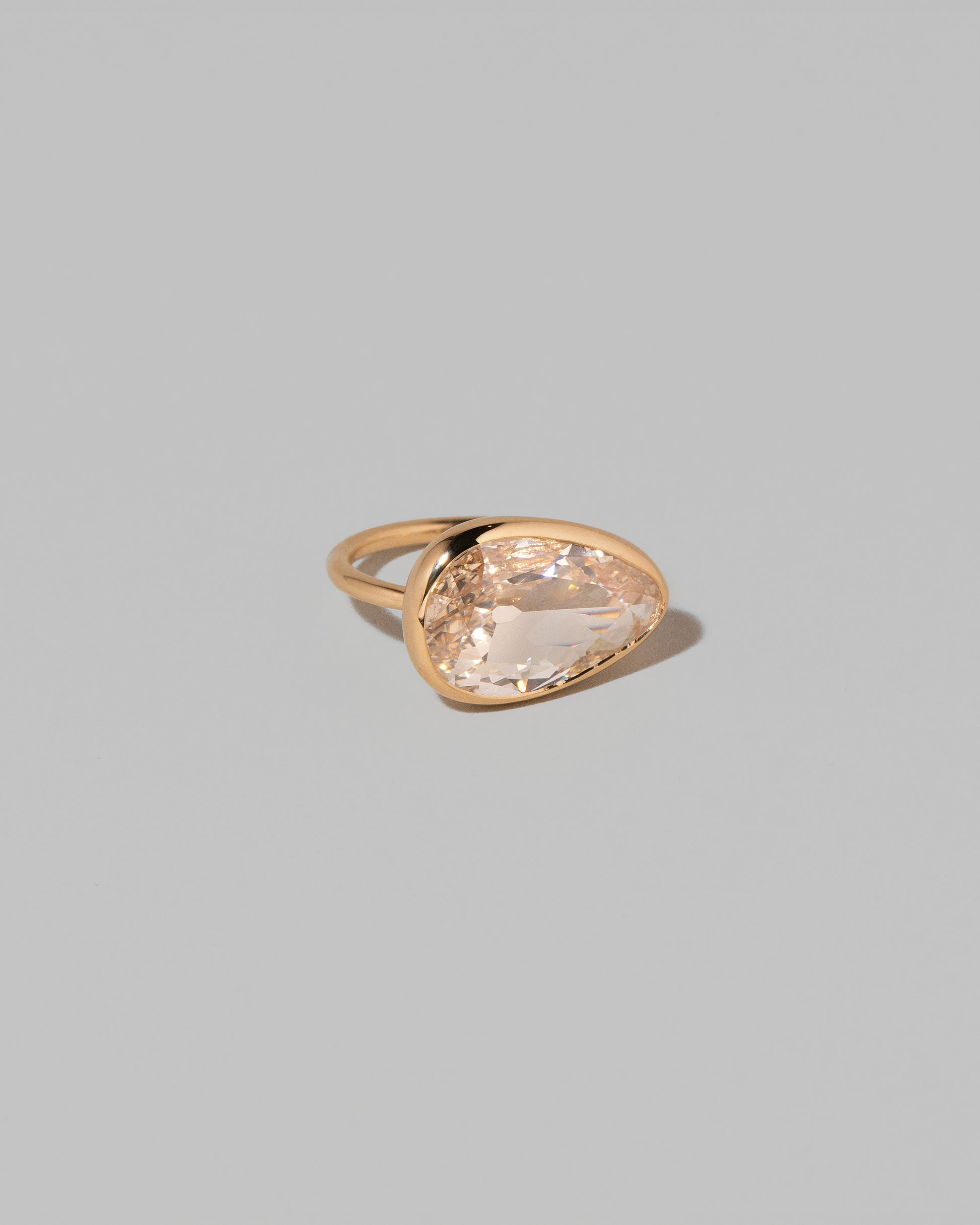 View from the side of the Gusher Diamond Ring 009 on light color background.