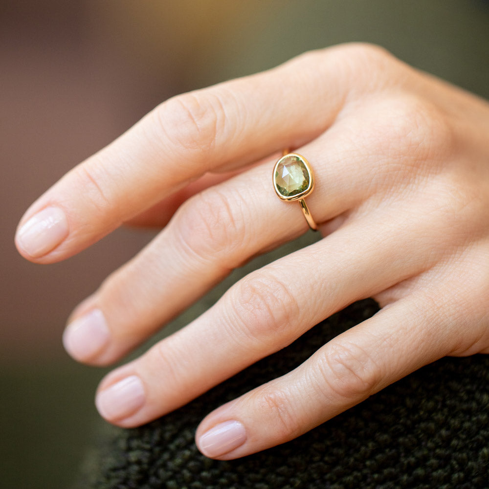 product_details::Gusher Green Sapphire Ring 004 on model.