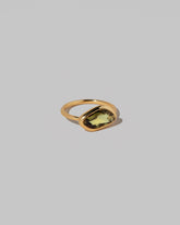 View from the side of the Gusher Green/Yellow Sapphire Ring 034 on light color background.
