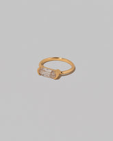 View from the side of the Moval Diamond Transformation Ring on light color background.