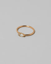 View from the side of the Opal Teardrops Ring on light color background.