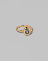 View from the side of the Oval Bicolor Sapphire Precise Ring on light color background.