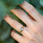 product_details::Oval Sapphire Equalize Ring on model.