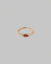 Red Garnet Teardrops Ring on light color background.
