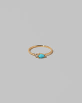 Turquoise Teardrops Ring on light color background.