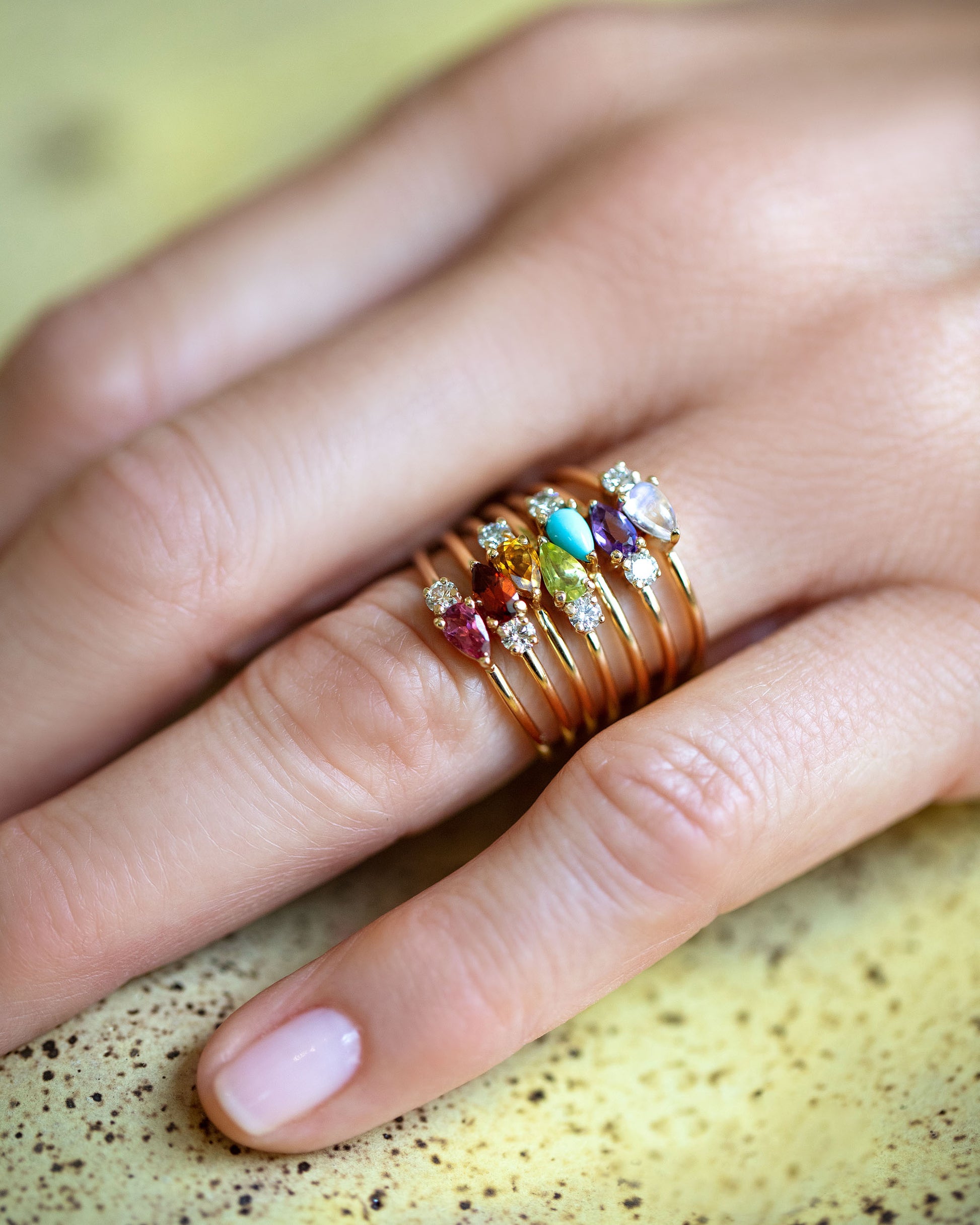 Pink Tourmaline, Red Garnet, Citrine, Peridot, Turquoise, Amethyst and Blue Moonstone  Teardrops Rings on model.