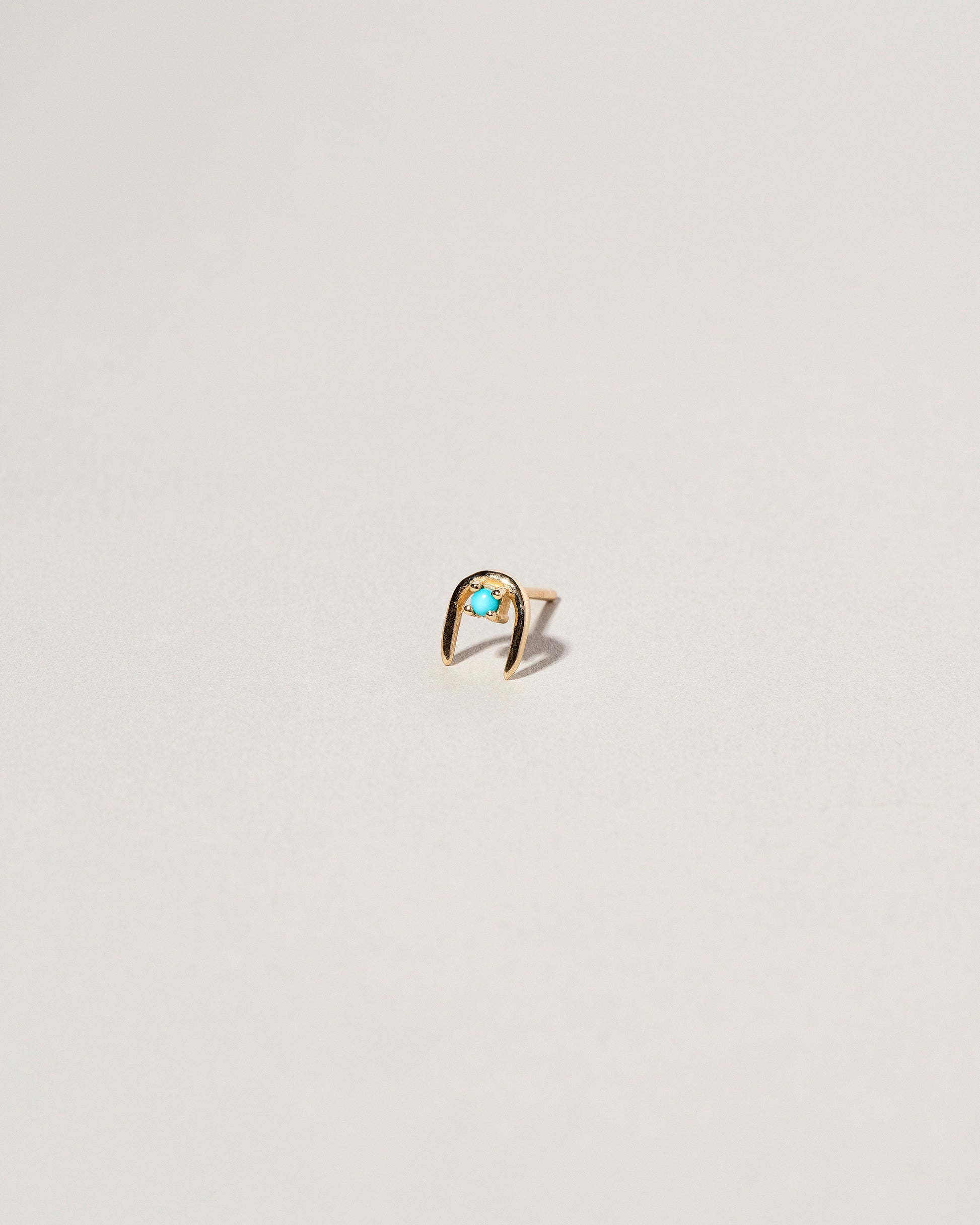 Turquoise Moon Catcher Stud Earring Single on light color background.