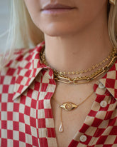 Segmented Chain Necklace, Short Loop Chain Necklace, Link Necklace and Diamond State Shifter Necklace on model.