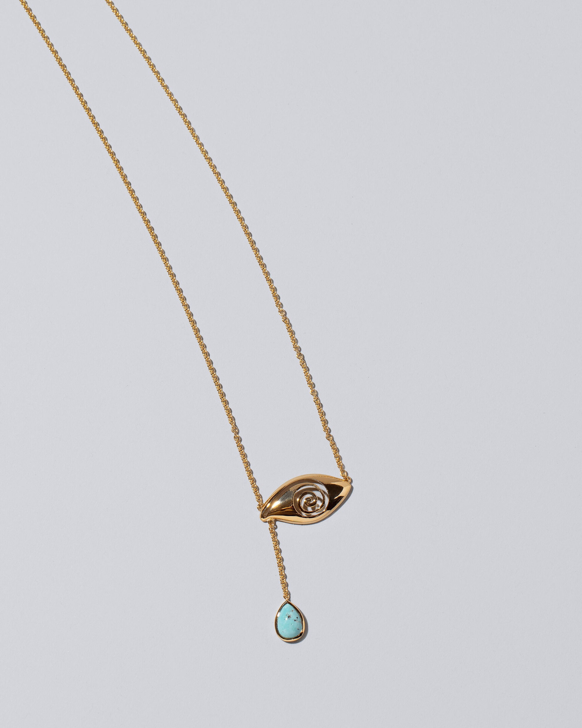 Turquoise State Shifter Necklace on light color background.