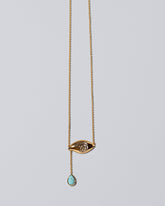 Turquoise State Shifter Necklace on light color background.