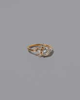 View from the side of the Mega White Diamond Vega Ring on light color background.