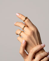 2.5mm, 4.5mm and 5.5mm Gold Venus Bands on model.