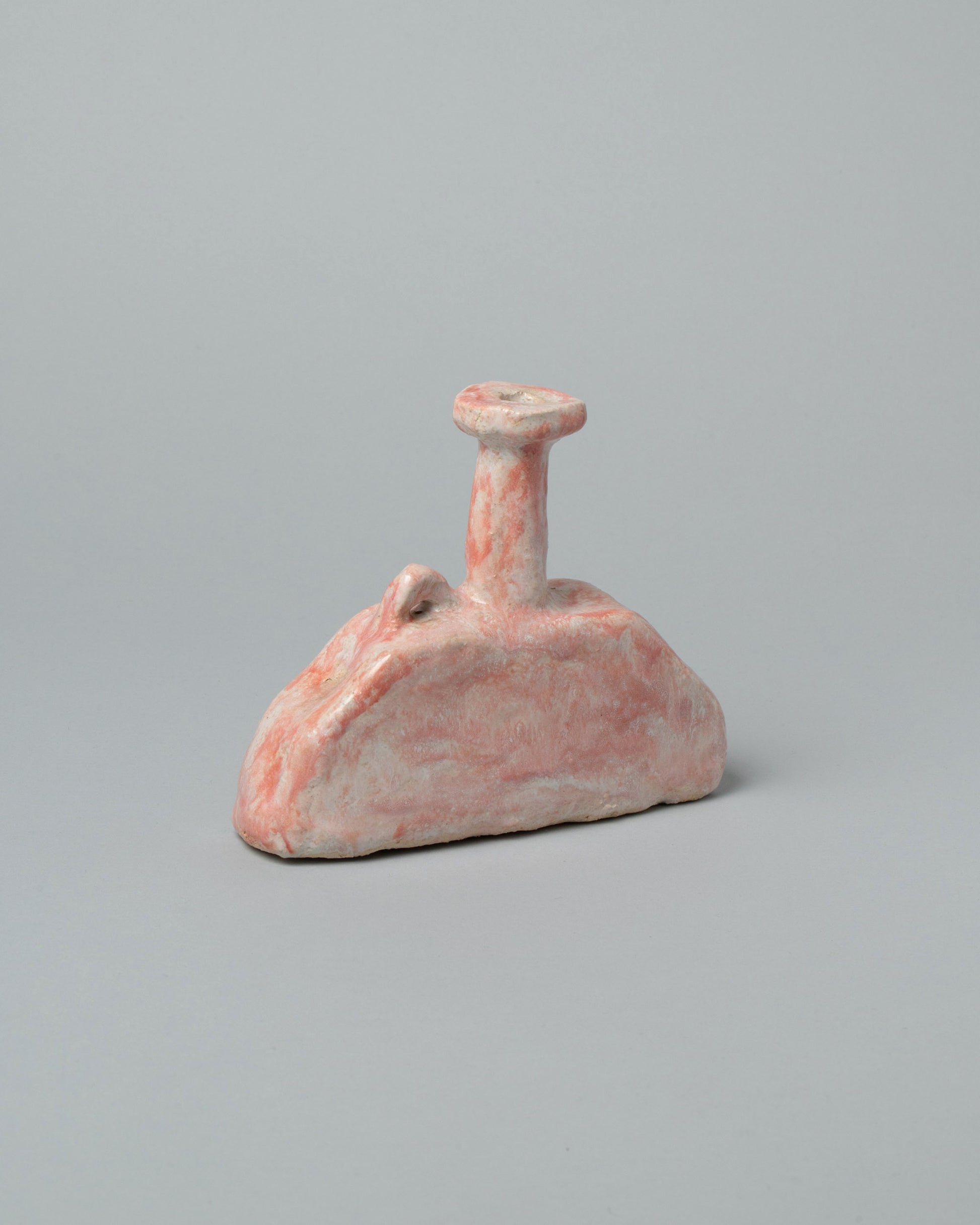 Closeup details of the Willem van Hooff Pink Streak Extra Small Core Sculpture on light color background.