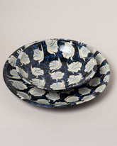 Closeup details of the Morgan Levine Midnight Pasta Bowl and Morgan Levine Midnight Platter on light color background.