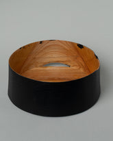 Inside view of the Namu Home Goods Medium Zelkova Wood Black Lacquered Vessel on light color background.